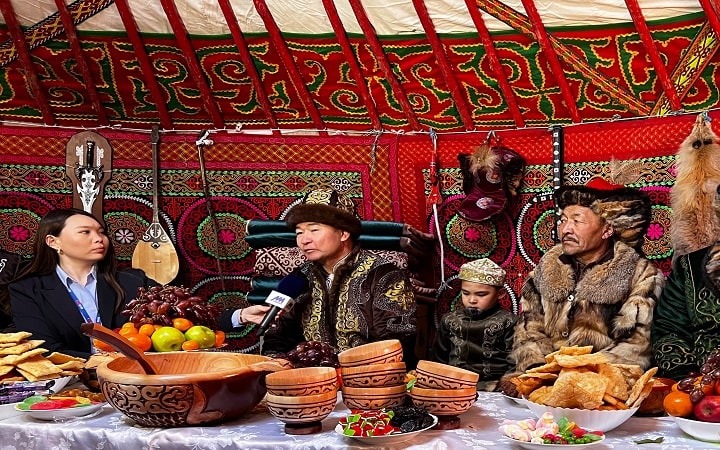 Photograph these colorfully dressed locals at Nauryz festival