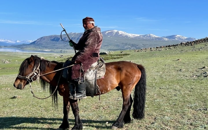 Kazakh herder man spending his summer in Altai Tavan Bogd national park, western Mongolia