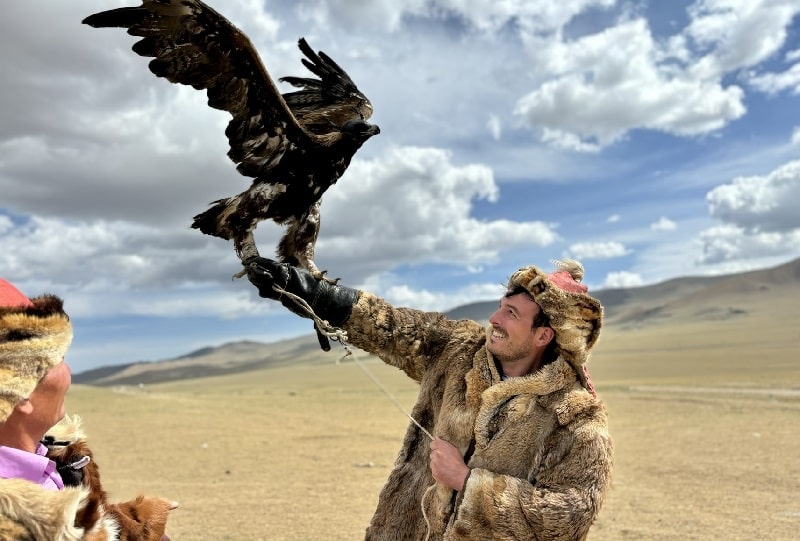 client holding golden eagle