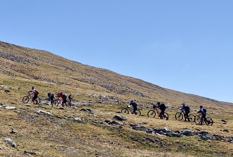 Mountain bikers in challenging path of Altai Mountains, Mongolia