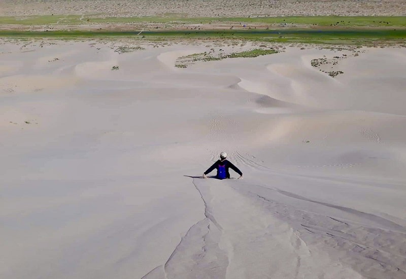 sliding on the sands of Khongor desert - Mongolia Family Tour