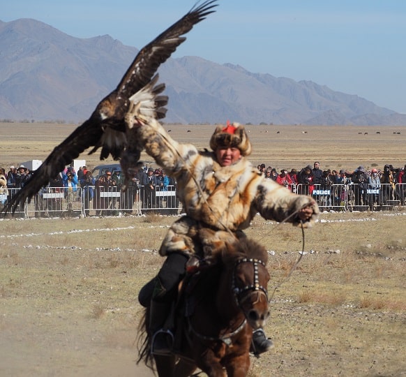 happy eagle hunter after his bird landed succesfully 