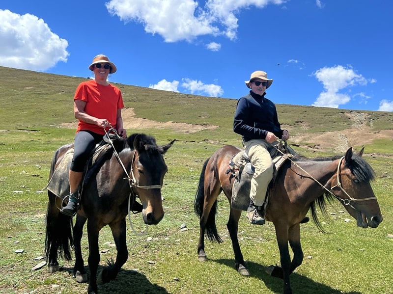 Clients enjoying themselves on horseback on our nomad homestay tour